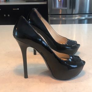 Black patent leather 4.5 in. high peep toe pumps